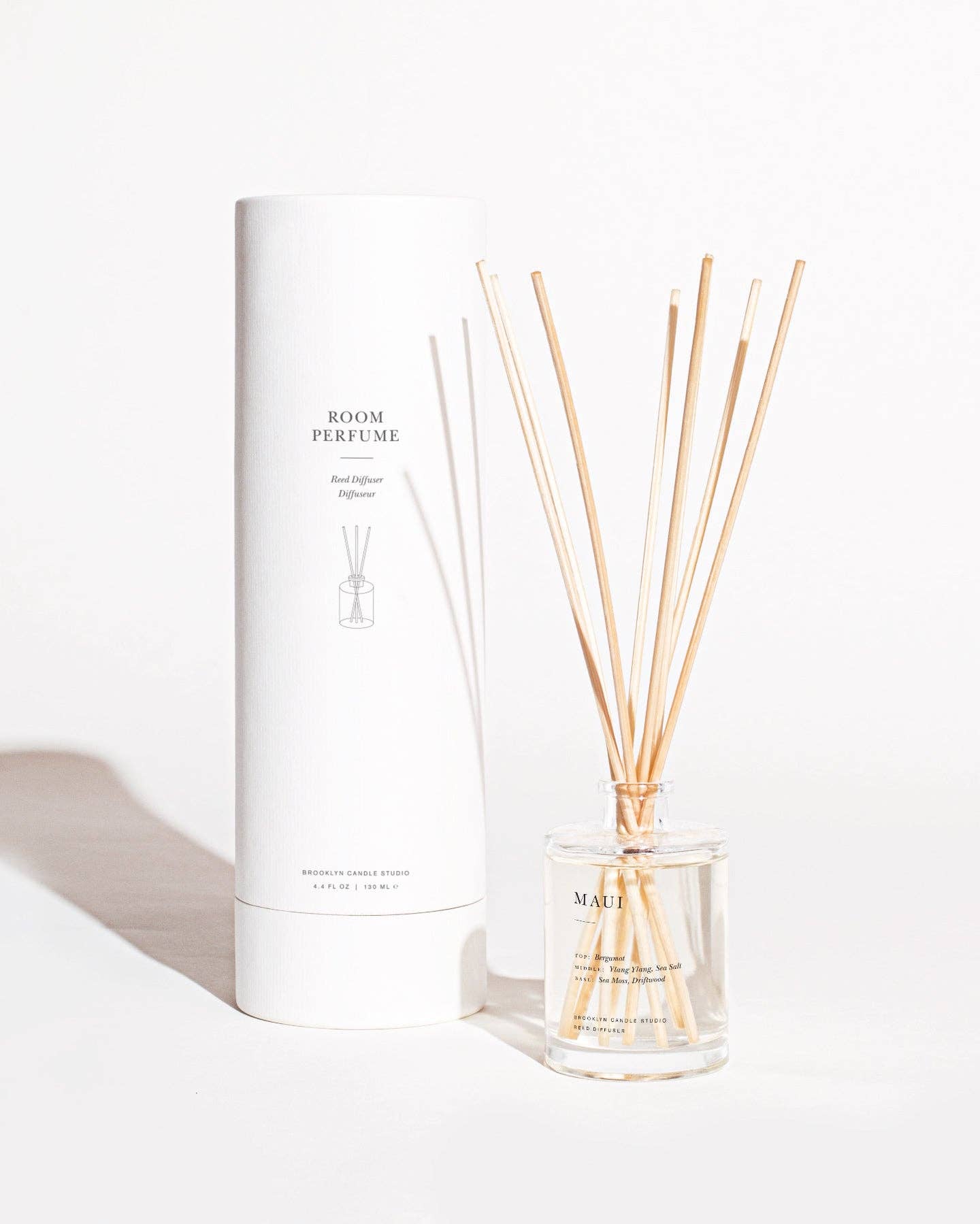 Room perfume set with diffuser and sticks on a white background