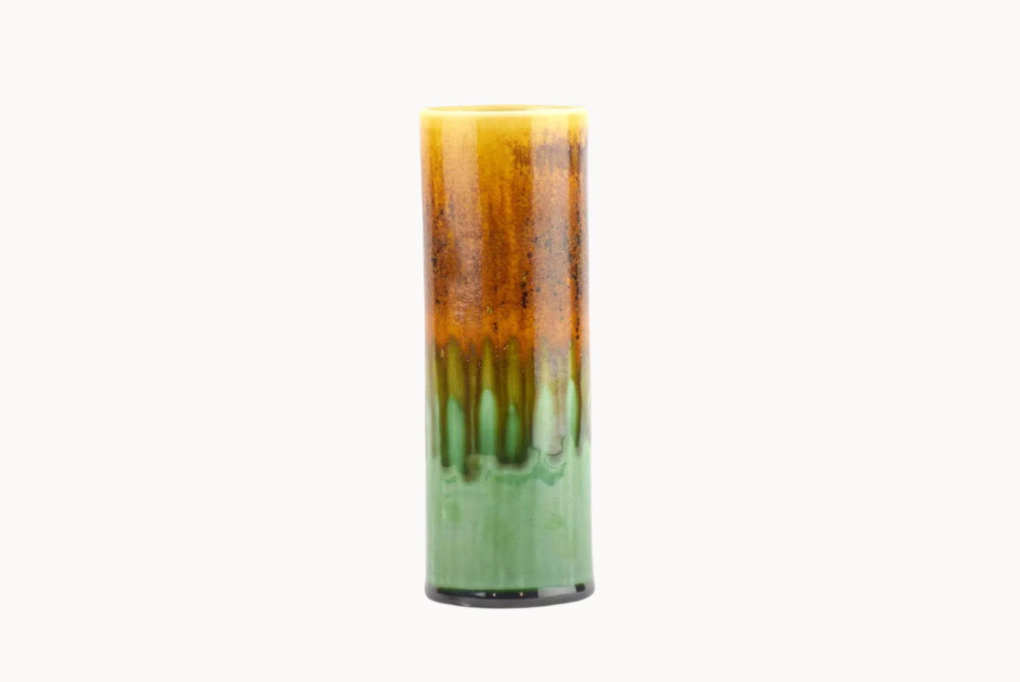 Gradient candle from brown to green on a white background