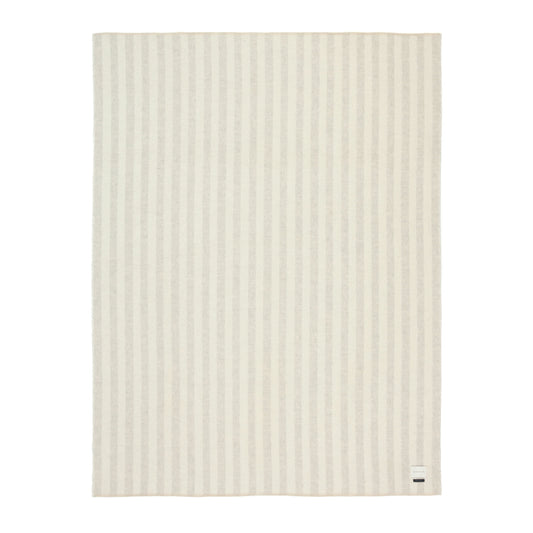 Beige Alpaca blanket with a subtle beige and ivory stripe pattern on a white background