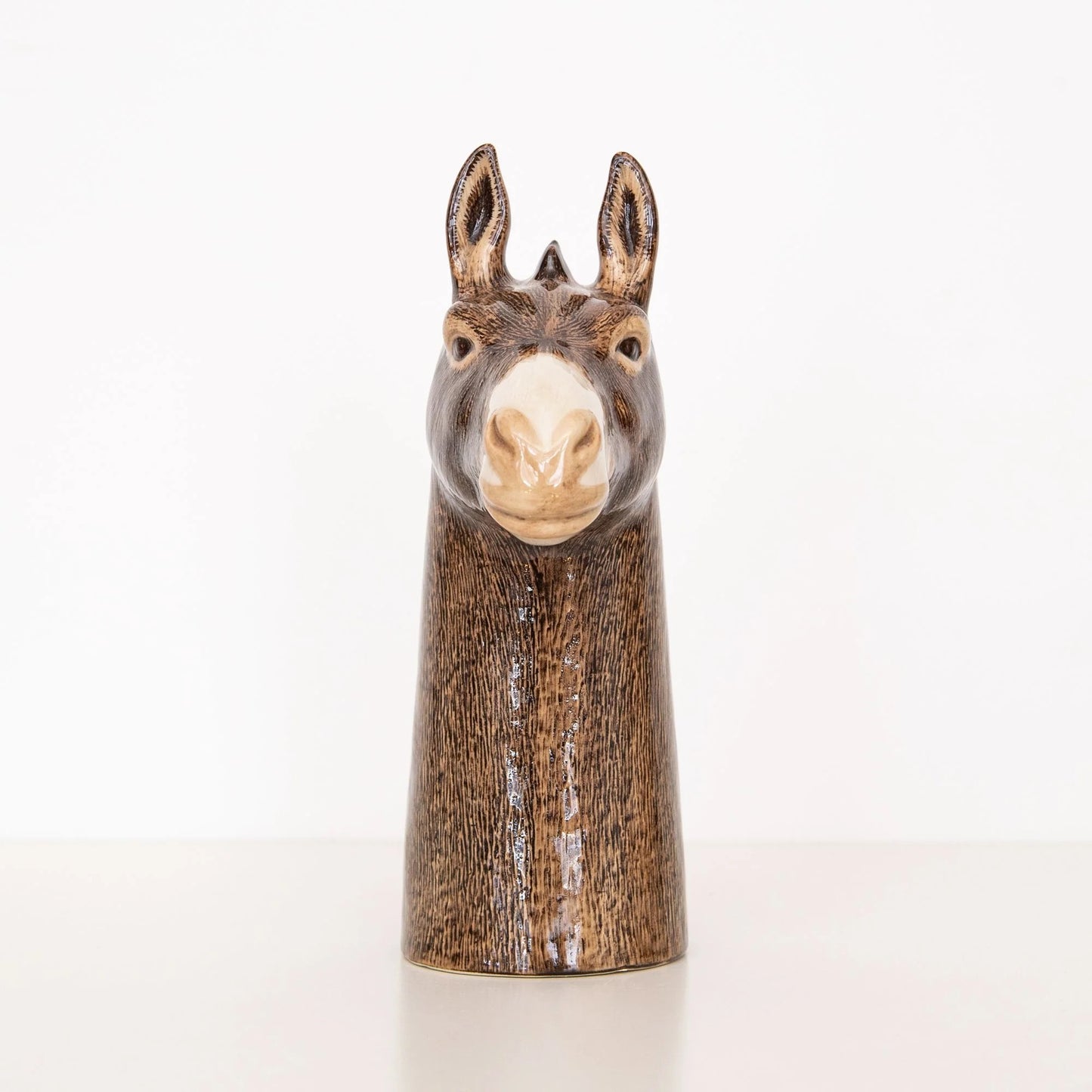 Decorative donkey head vase on a white background