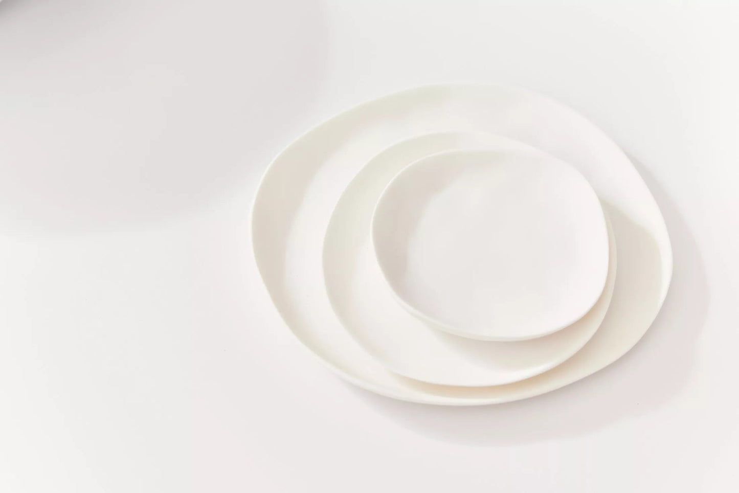 Set of white Sculpt Plates from Tina Frey Design