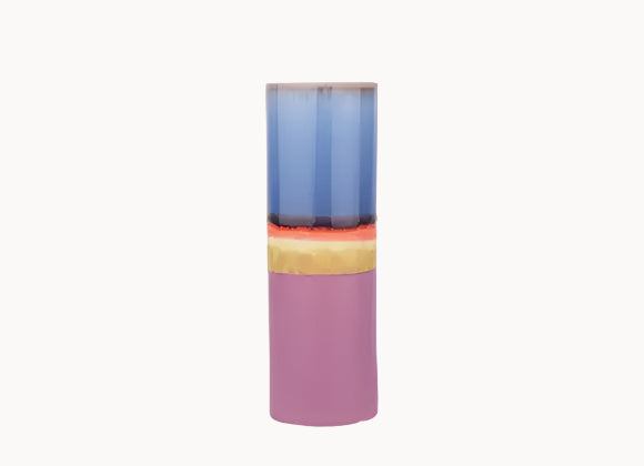 Colorful cylindrical vase with a gradient from blue to pink on a white background
