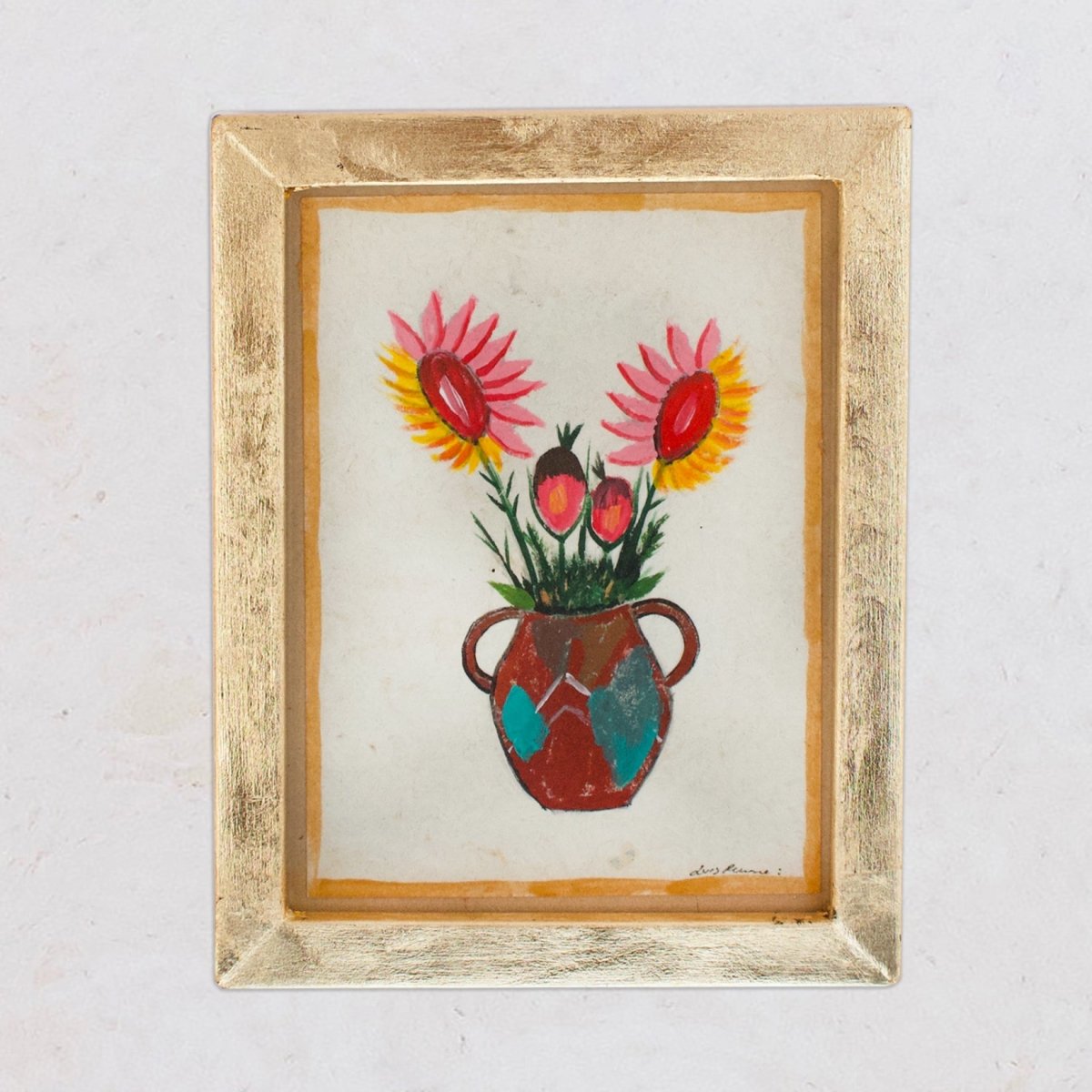 A framed painting of a colorful floral arrangement in a pot, with a golden-leaf wooden frame.