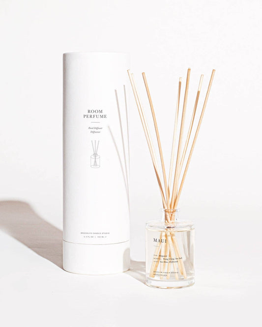 Room perfume set with diffuser and sticks on a white background