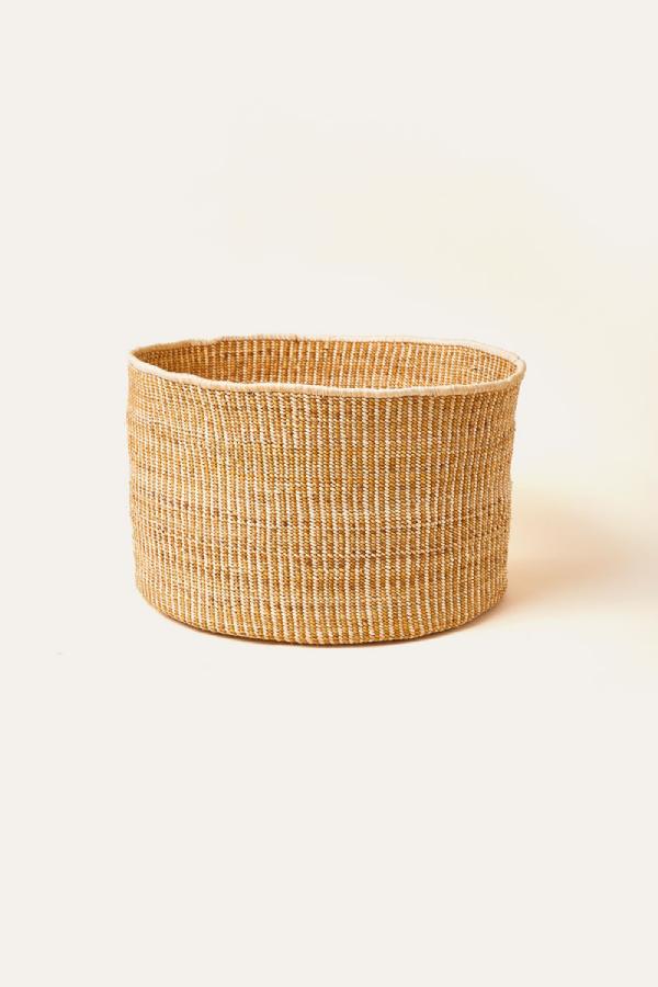 Woven basket on a beige background
