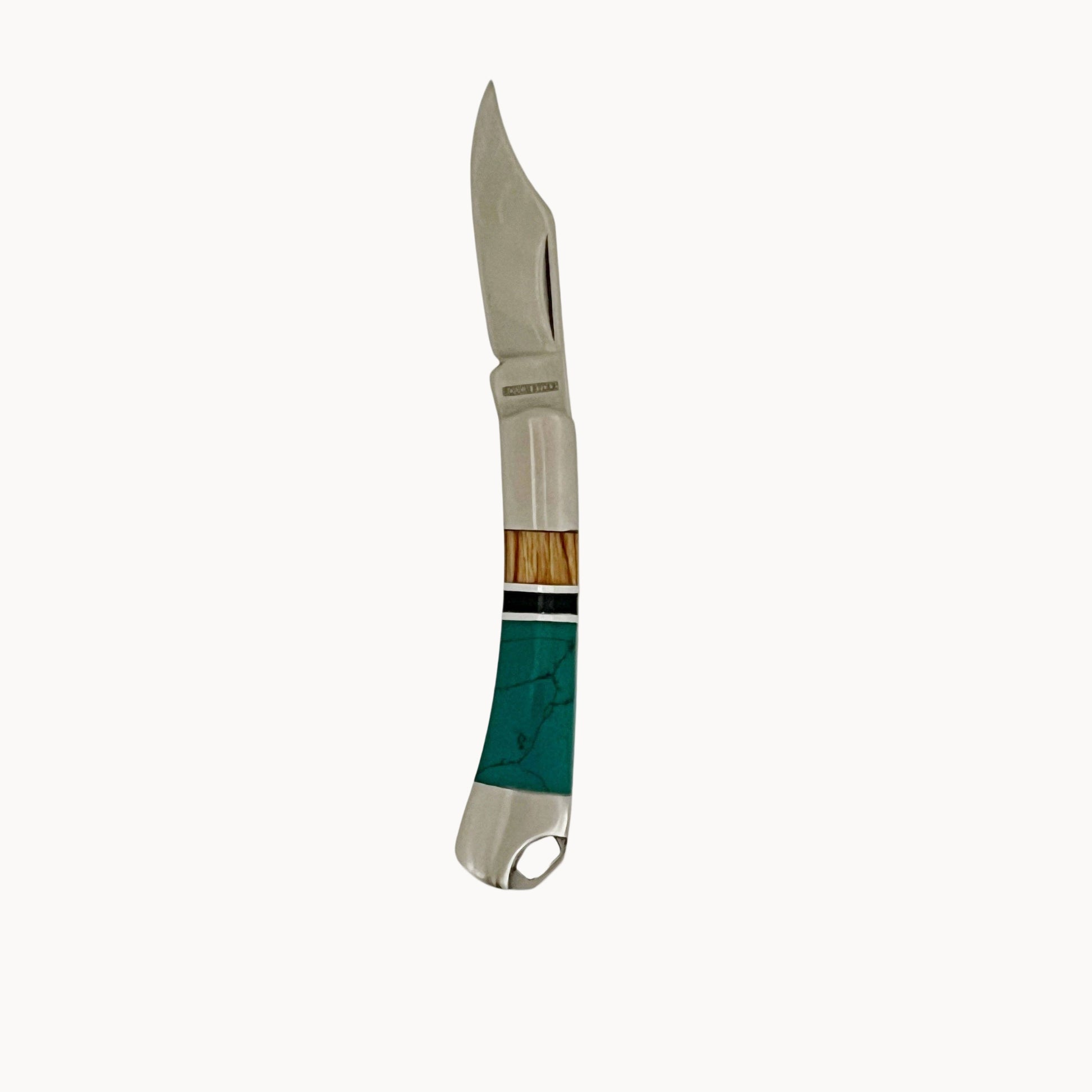 Steel folding pocket knife with a wood and turquoise handle on a white background