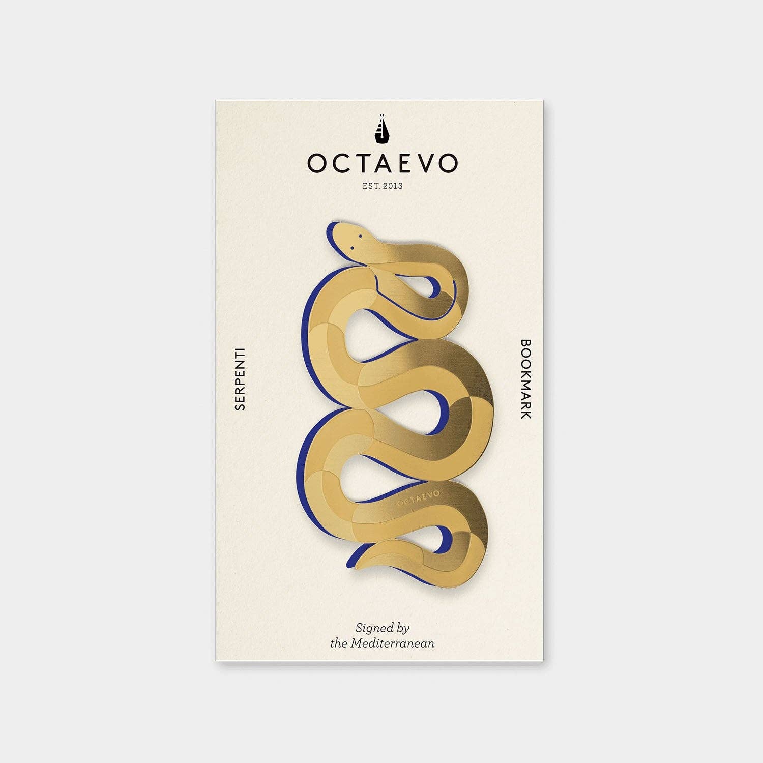 A beige bookmark with an abstract gold snake design