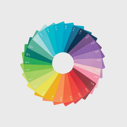 Set of gradient playing cards against a neutral backround