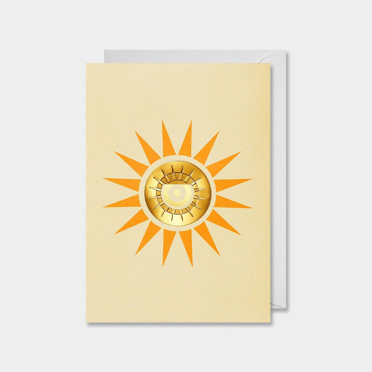 A greeting card with a yellow background and a radiant sun design, featuring a golden metallic center.