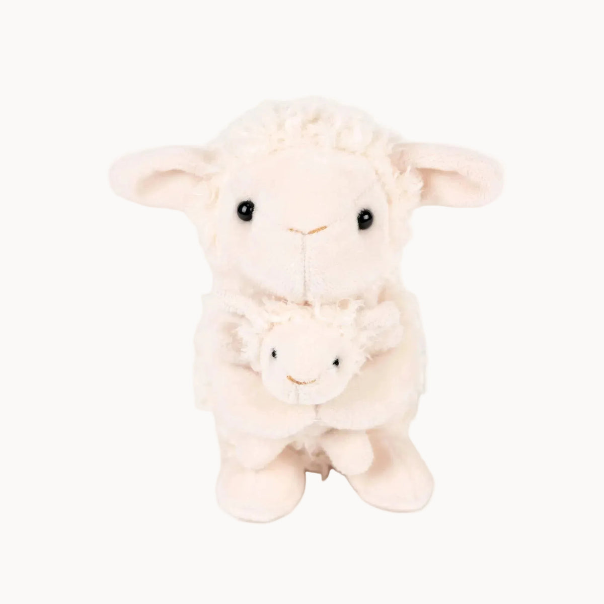 Plush toy lamb on a white background