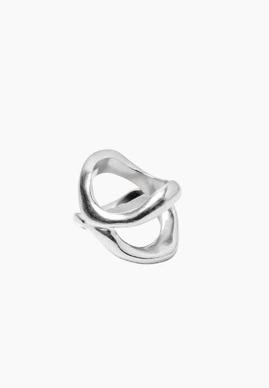 Silver ring with a unique design on a white background