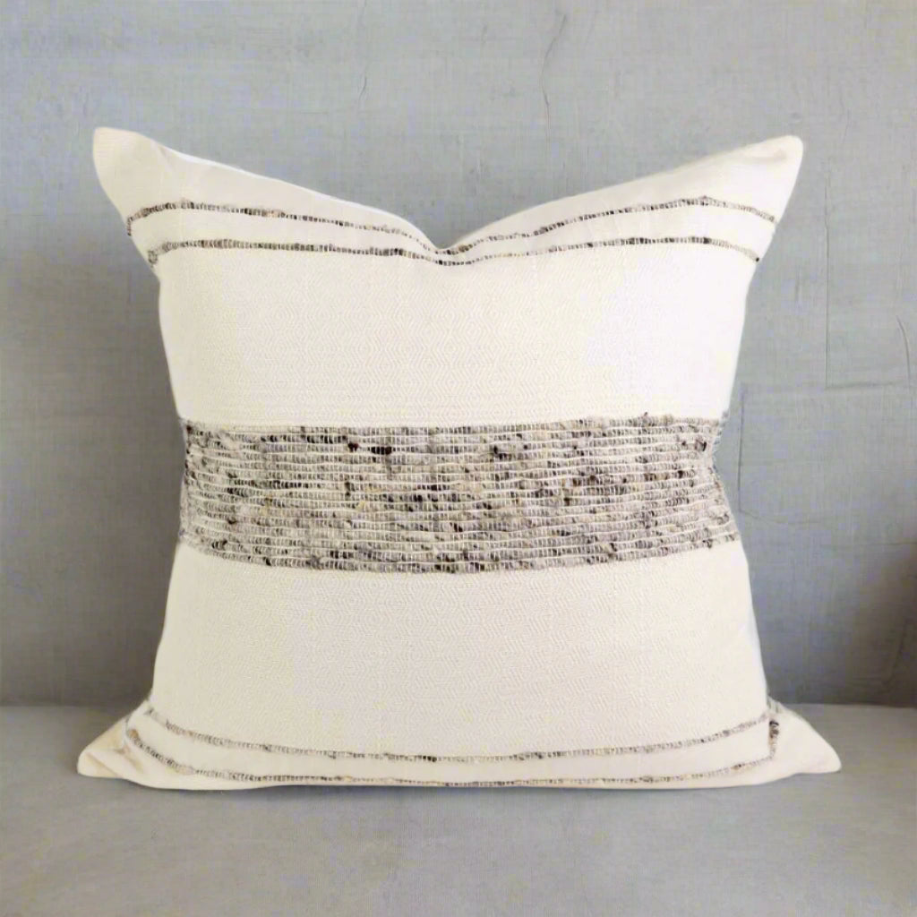 A grey and white striped throw pillow cover with a solid grey band in the center.