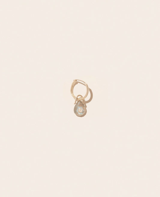 A single gold hoop earring with a smoky Labradorite gemstone and a small diamond