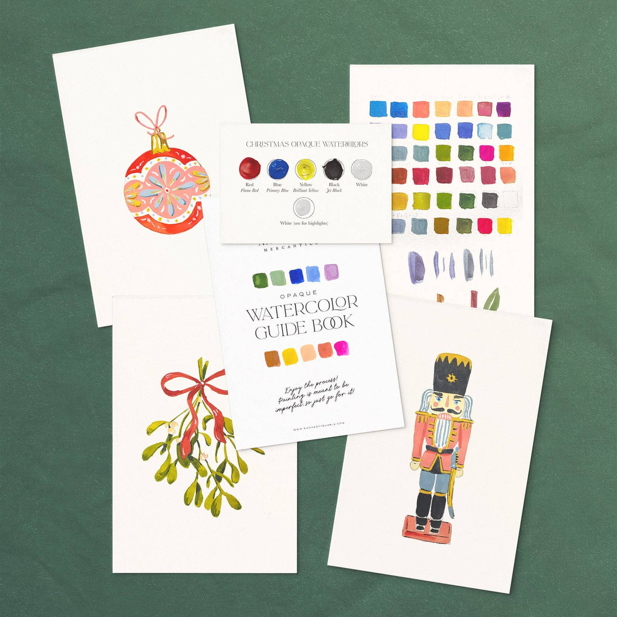 Set of watercolor guide books and color swatches on a green background