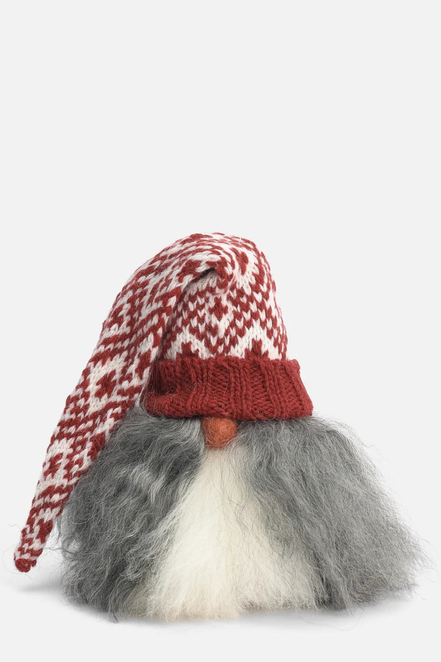 Gnome figurine with a red and white patterned hat on a light gray background