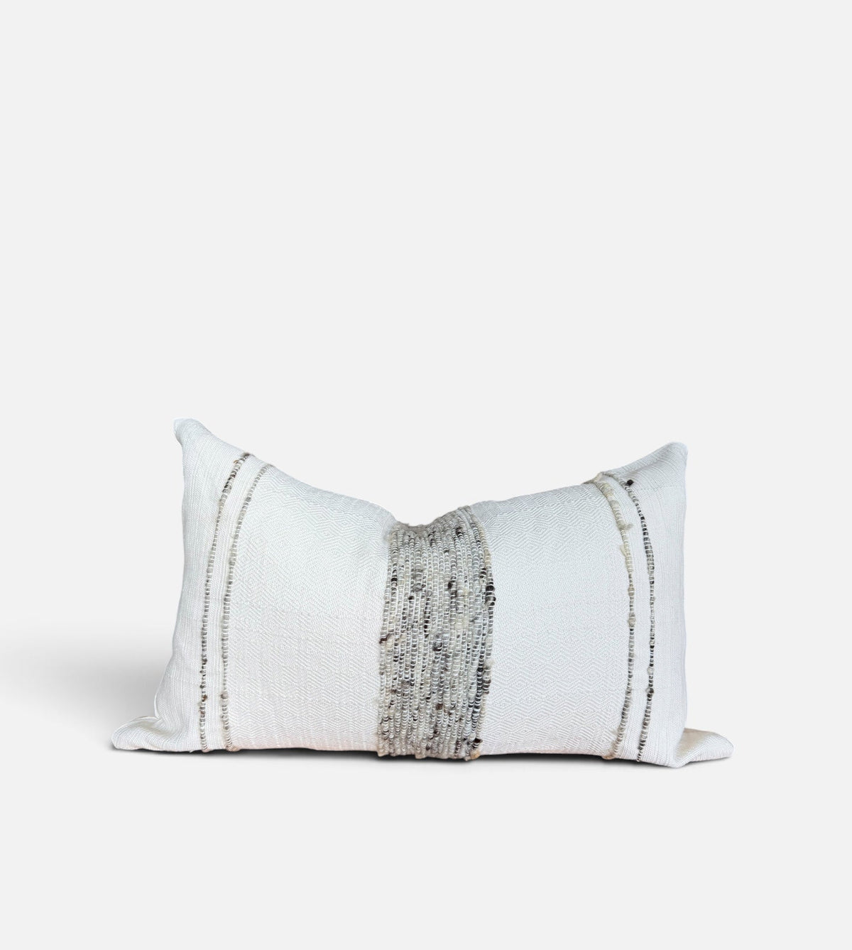 A rectangular white throw pillow with a central vertical textured gray stripe and two thin vertical metallic gold stripes on either side, shown on a light gray background.