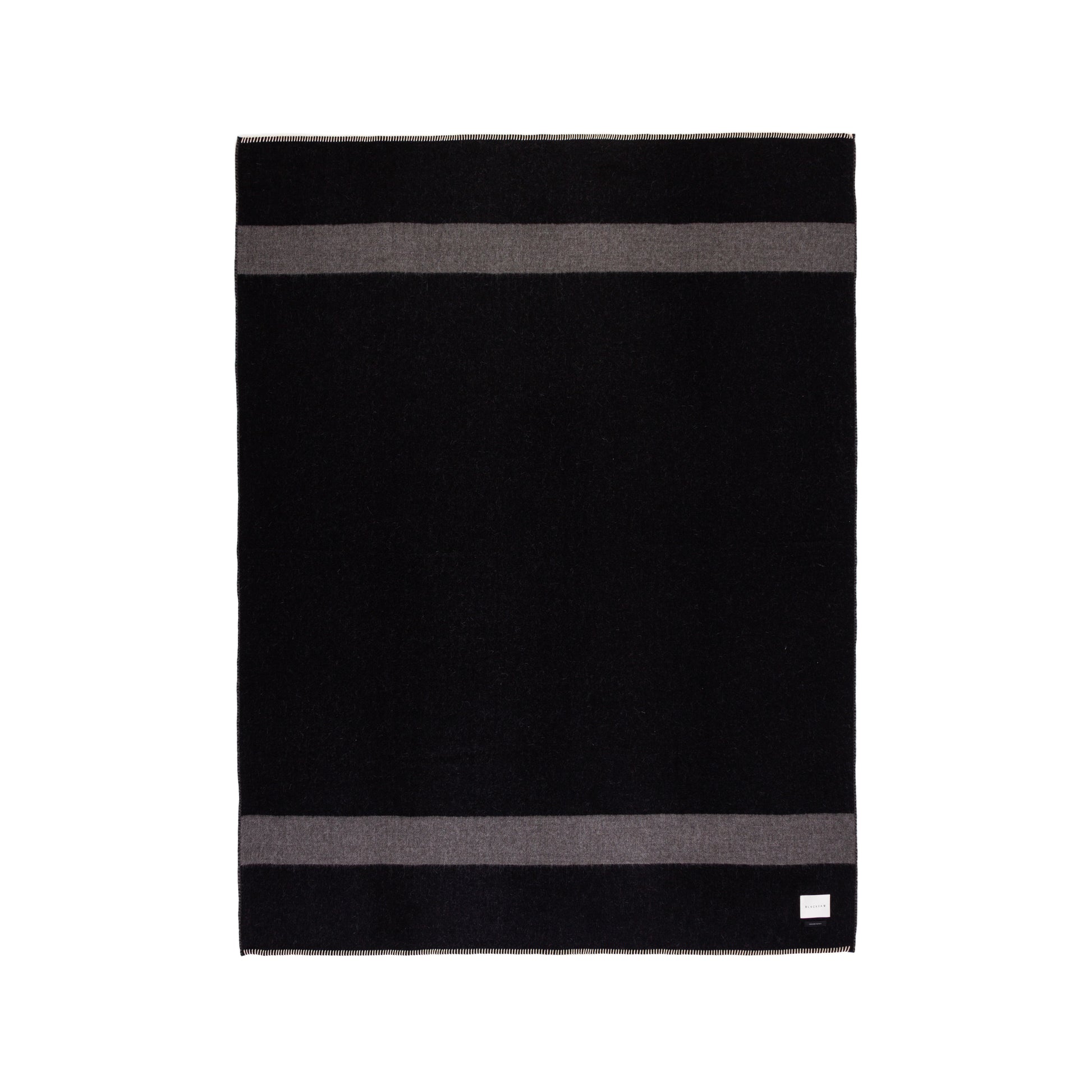 Black and gray striped Alpaca wool blanket on a white background