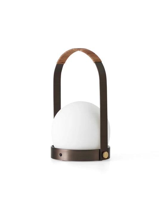 Modern outdoor lamp with white shade and wooden handle on a white background