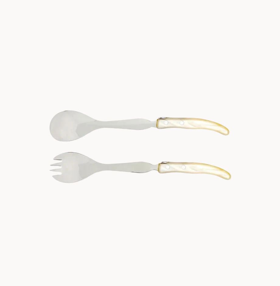 Set of salad utensils with ivory colored handles on a white background