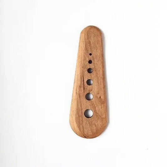 Wooden herb stripper on a white background