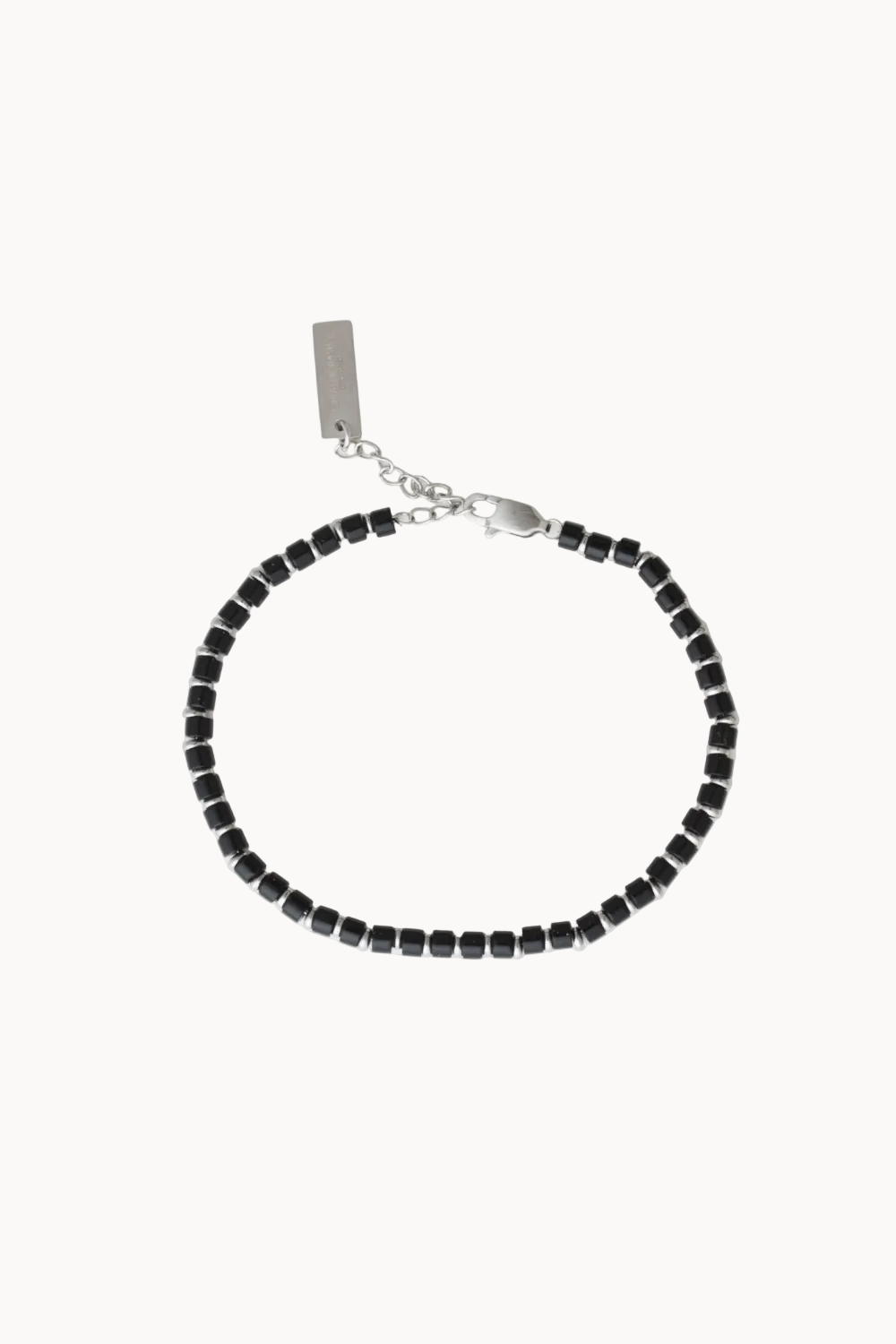 Black beaded bracelet with silver clasp on a white background