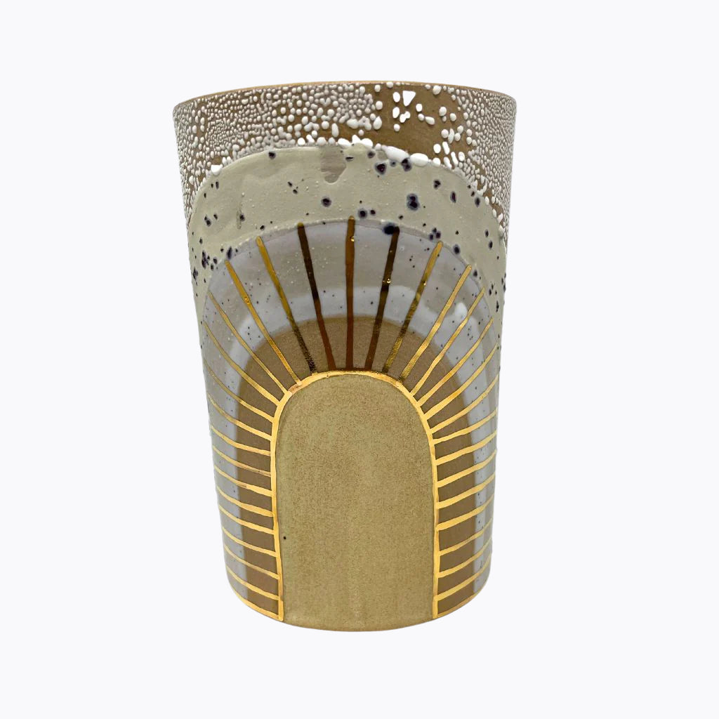 A handcrafted ceramic vase with beige and brown colors, featuring gold luster detailing, displayed against a plain background.