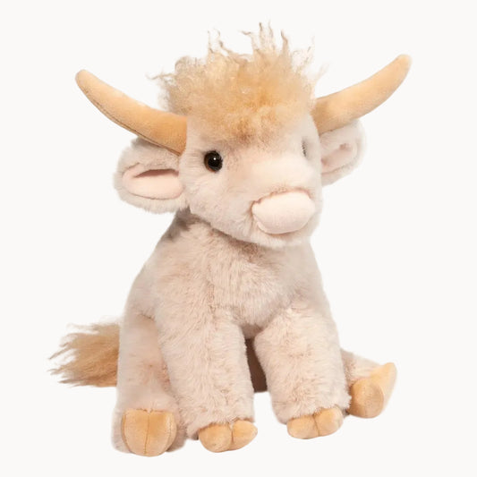 Plush toy of a baby cow with horns on a white background