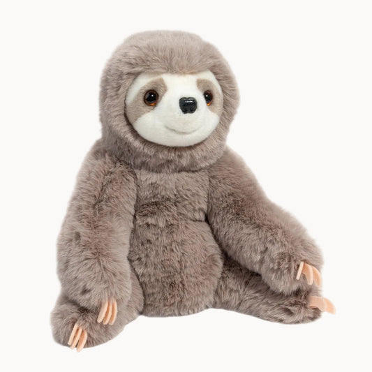 Plush toy sloth seated on a white background