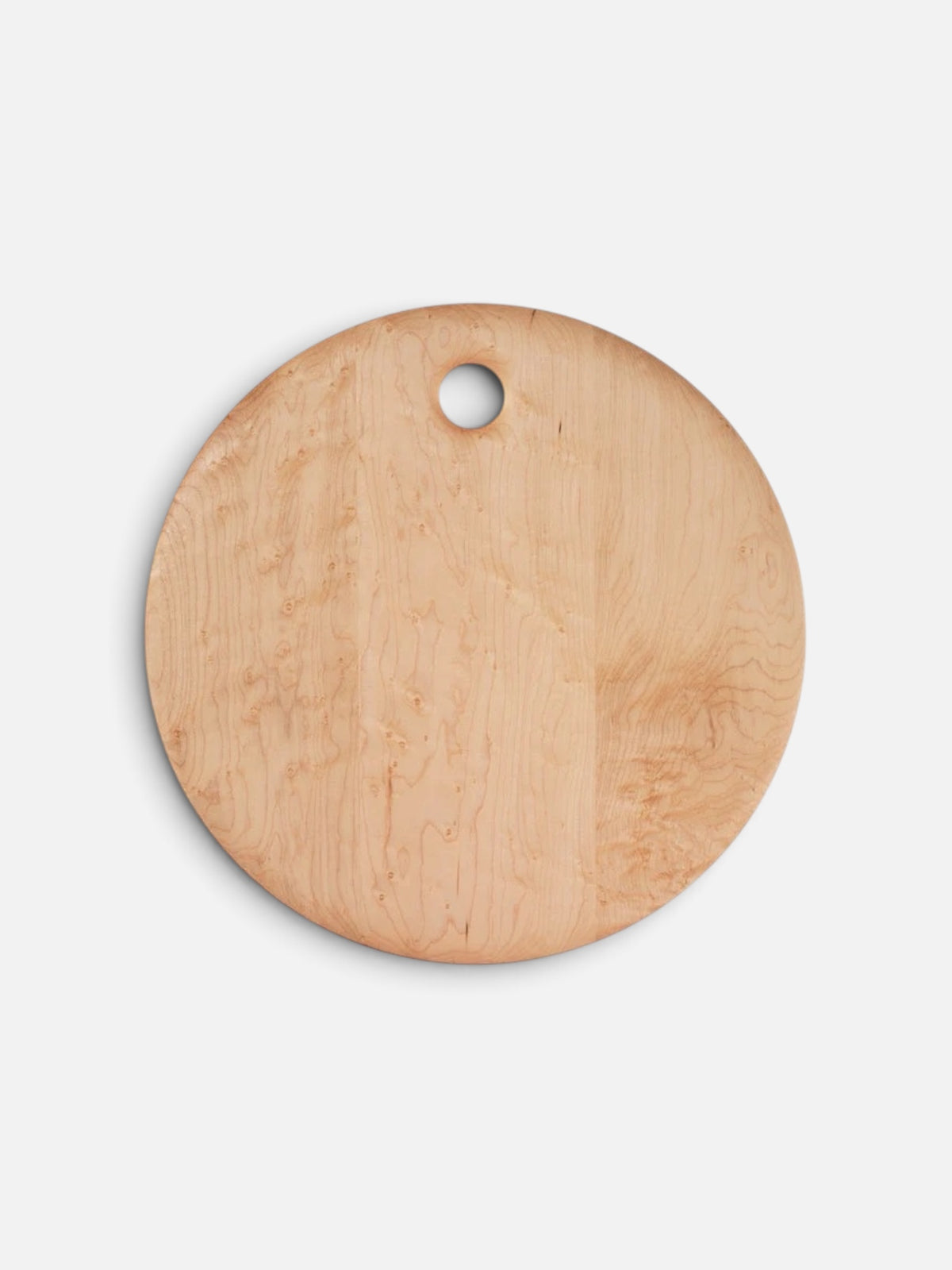 A round light wood cutting board with a natural grain pattern and a small hanging hole near the top, shown on a clean white background.