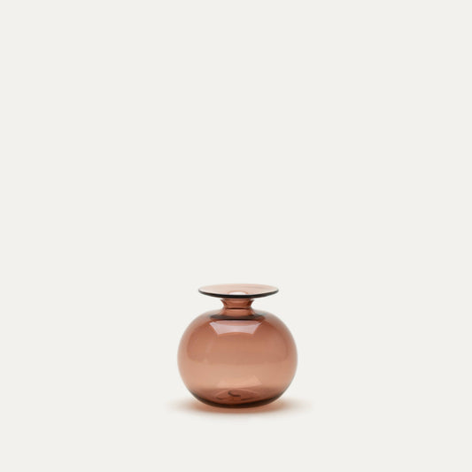 Smoky pink glass vase on a light beige background