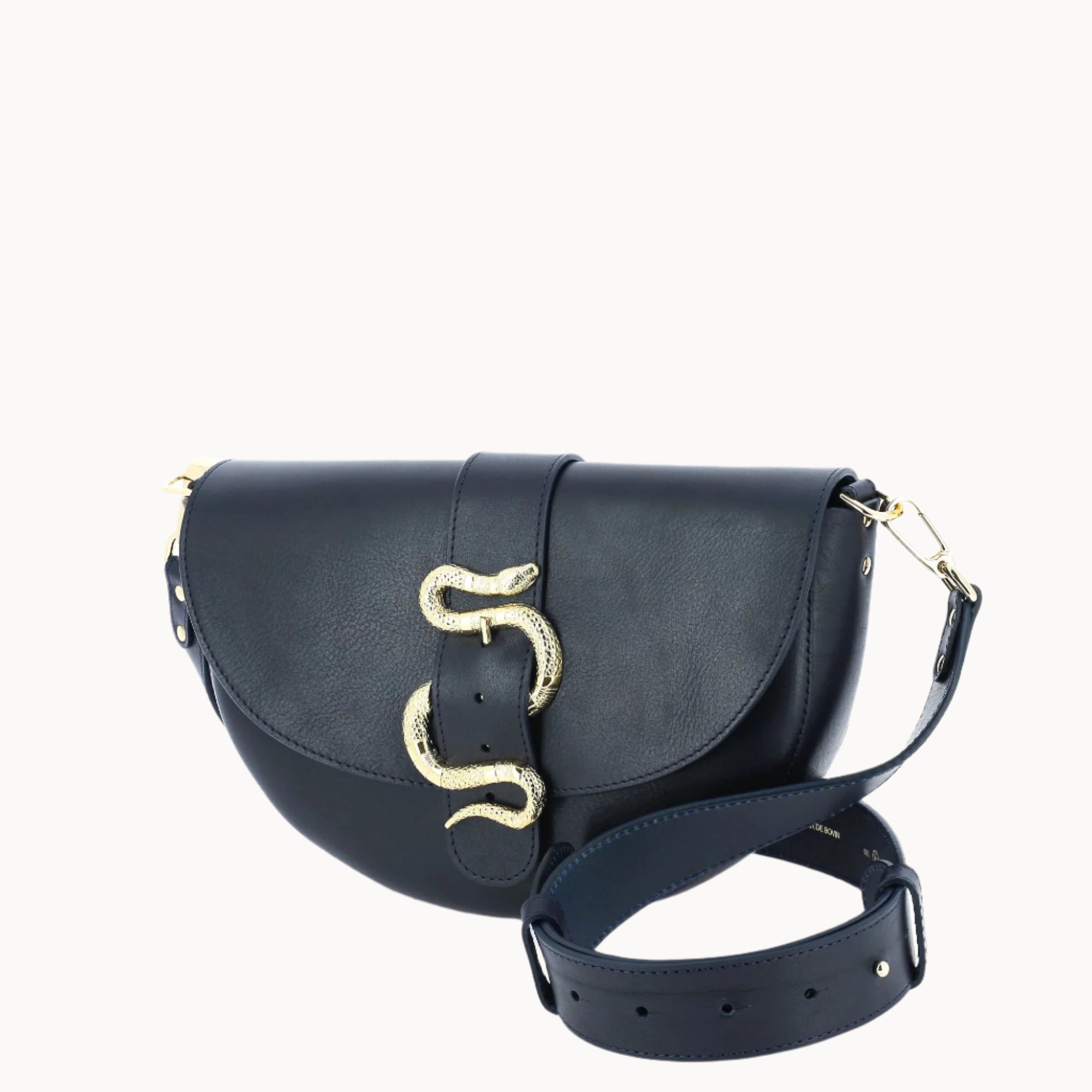 Dark navy leather handbag with strap and gold snake-shaped clasp on a white background