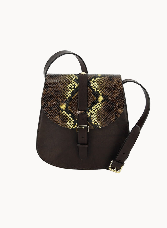 Brown leather saddlebag-style purse with snake print flap and buckle closure on a white background