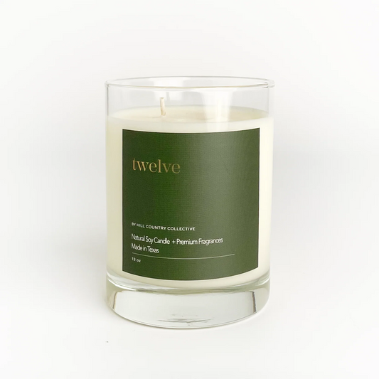 Candle with a green label on a white background