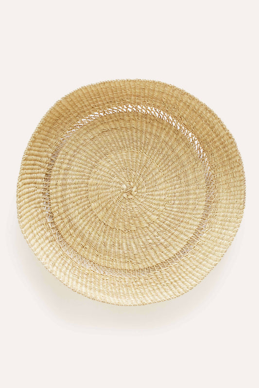 Woven round basket on a white background