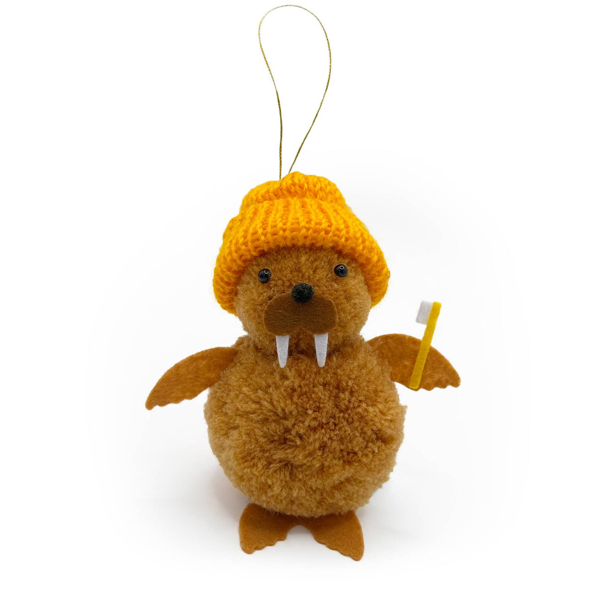 Plush walrus christmas tree ornament wearing a yellow knitted hat and holding a toothbrush, on a white background