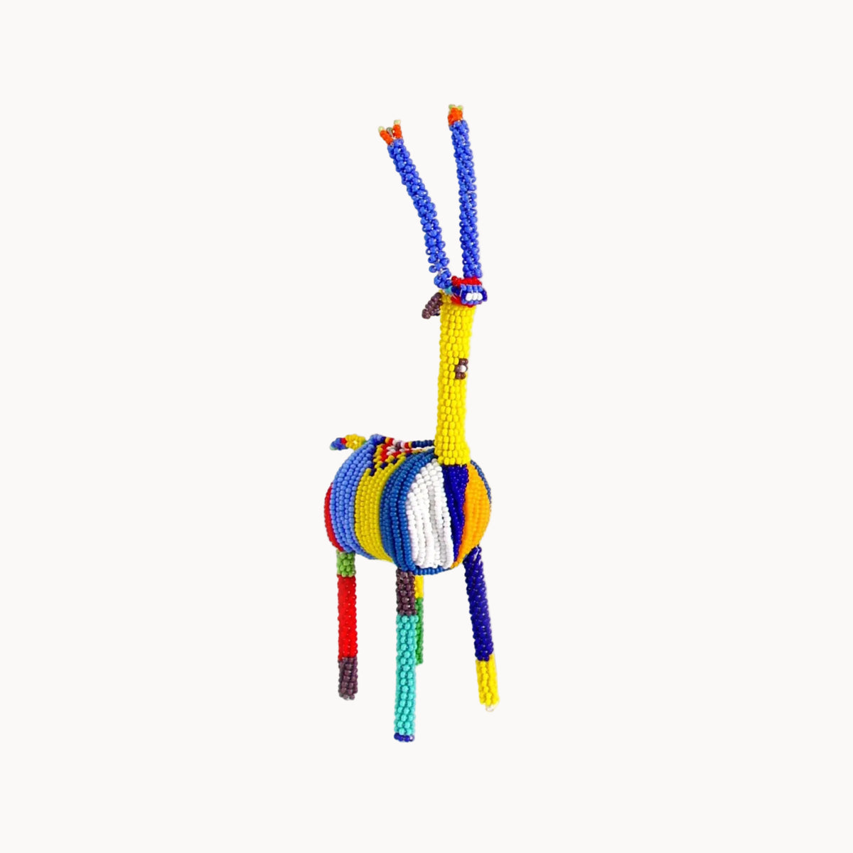 Colorful beaded springbok figurine on a white background