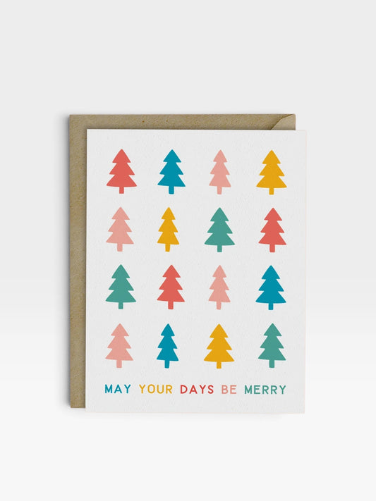 Holiday greeting card featuring a white background and rows of colorful trees with may your days be merry printed at the bottom.