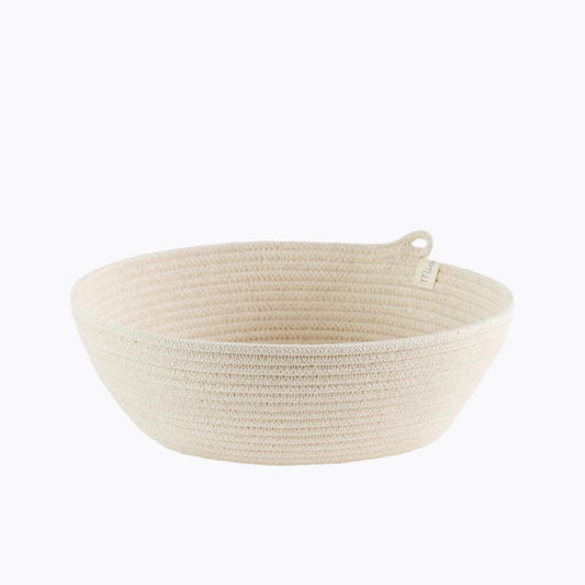 A beige rope bowl basket made from natural cotton, displayed against a neutral background.