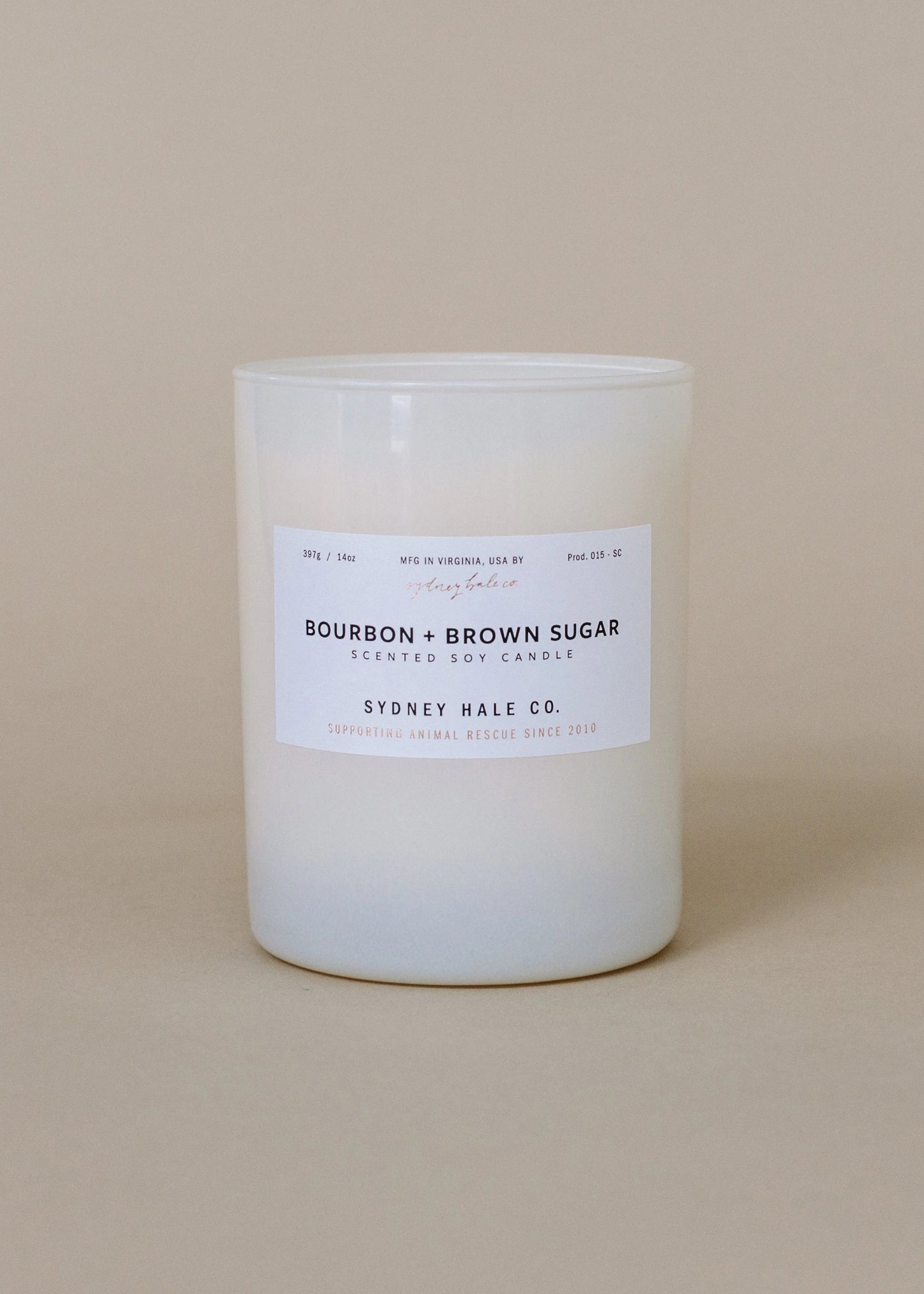 Sydney Hale Bourbon and Brown Sugar candle on a beige background