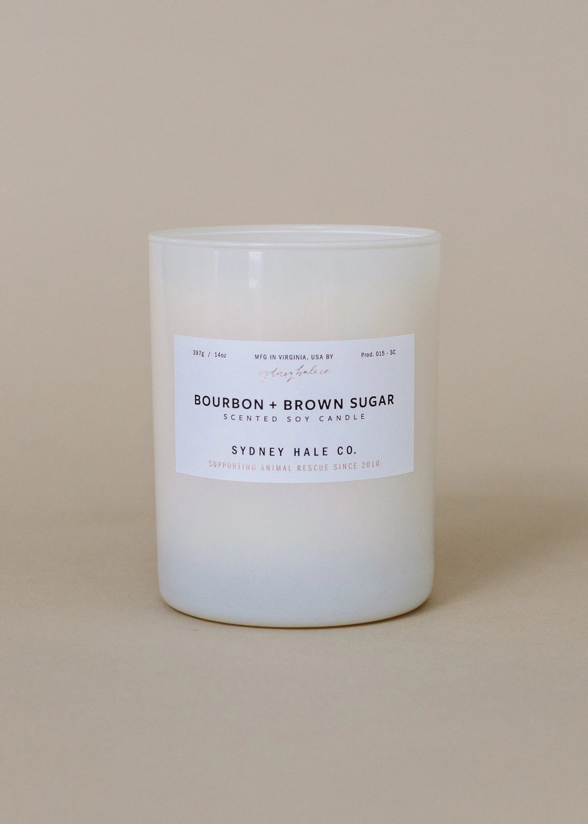 Sydney Hale Bourbon and Brown Sugar candle on a beige background