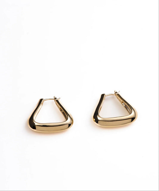 Gold triangle-shaped earrings on a white background