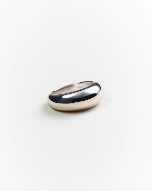 Silver ring on a light gray background