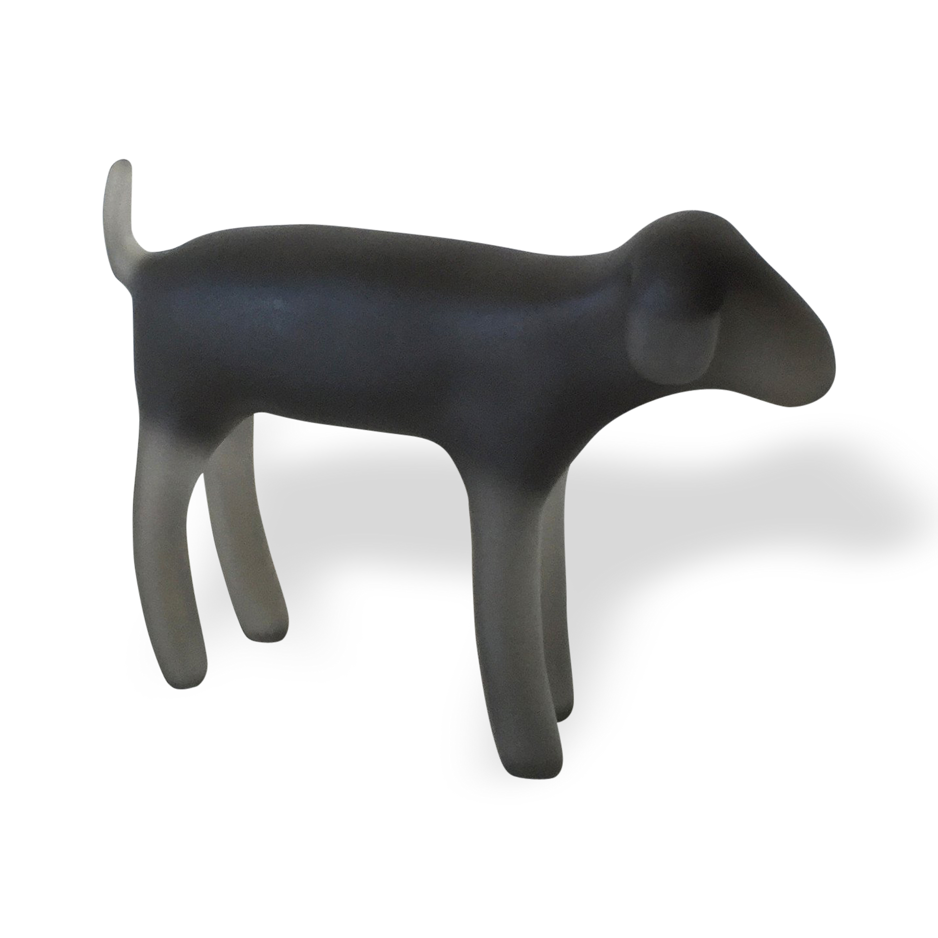 A sculpture of a dog in a standing pose, predominantly black in color.
