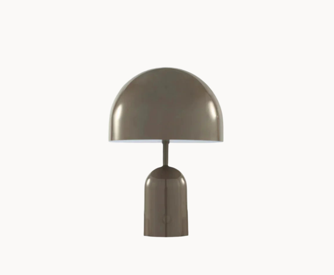 A portable LED lamp with a domed shape in a polished taupe finish