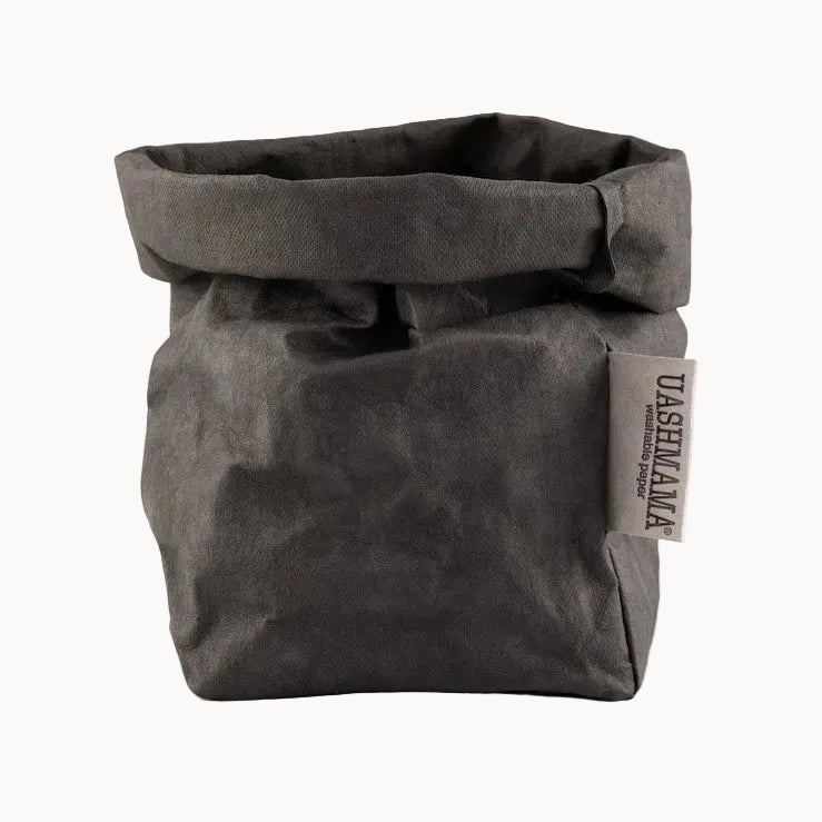 Gray fabric bag with a visible brand label on a white background