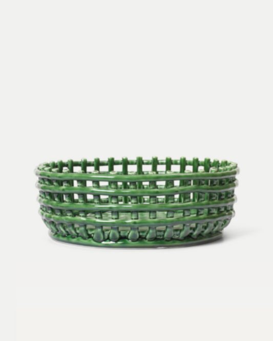 A green woven ceramic centerpiece basket with a textured design, isolated on a white background.