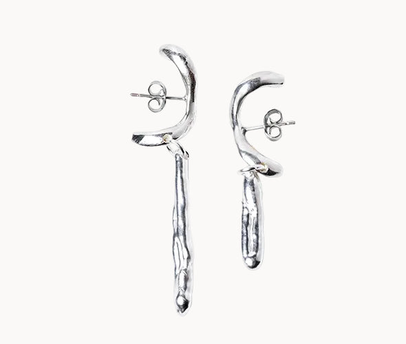 Pair of silver earrings on a white background
