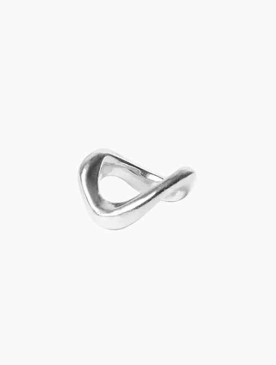 Silver ring with a wave-like design on a white background