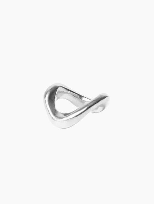 Silver ring with a wave-like design on a white background