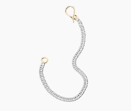 Silver chain bracelet with gold clasp on a white background
